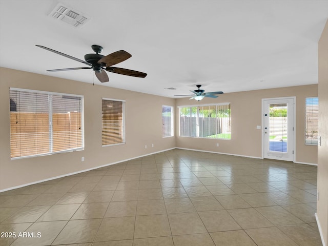 13620 N 82nd Ln, Peoria, AZ 85381 - spare room with plenty of natural light, ceiling fan, baseboards, and light tile patterned floors