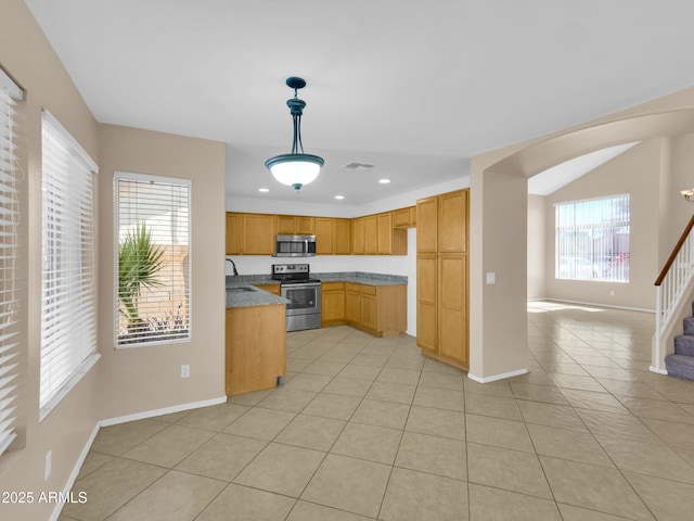 13620 N 82nd Ln, Peoria, AZ 85381 - kitchen with appliances with stainless steel finishes, arched walkways, baseboards, light tile patterned floors, and recessed lighting