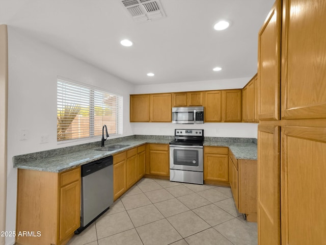 13620 N 82nd Ln, Peoria, AZ 85381 - kitchen with appliances with stainless steel finishes, a sink, light tile patterned floors, and recessed lighting