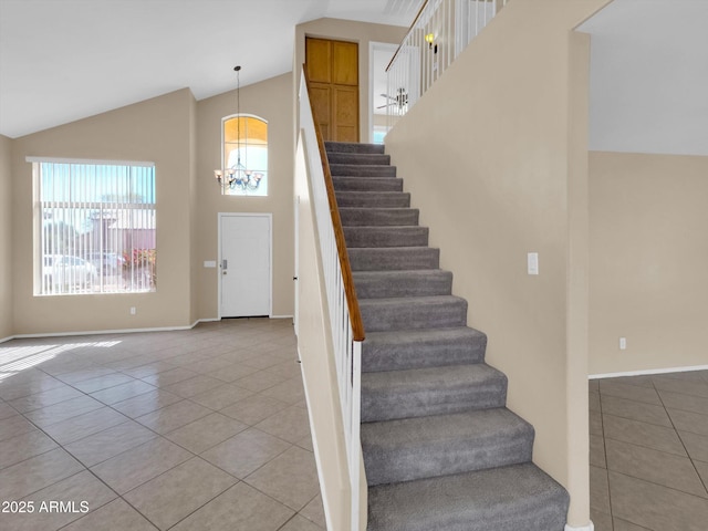 13620 N 82nd Ln, Peoria, AZ 85381 - stairs featuring tile patterned floors, a chandelier, high vaulted ceiling, and baseboards
