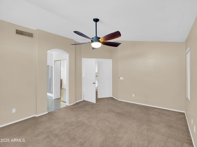 13620 N 82nd Ln, Peoria, AZ 85381 - unfurnished bedroom featuring carpet, arched walkways, baseboards, and vaulted ceiling