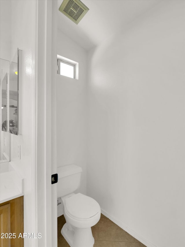 13620 N 82nd Ln, Peoria, AZ 85381 - bathroom featuring vanity, toilet, tile patterned flooring, and baseboards