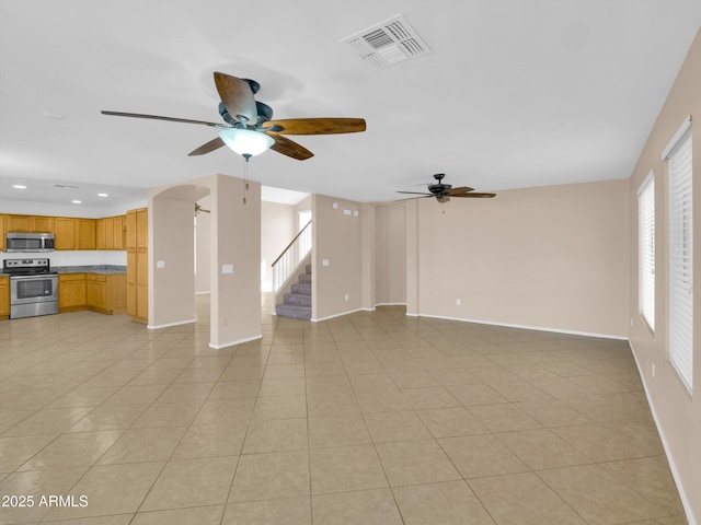 13620 N 82nd Ln, Peoria, AZ 85381 - unfurnished living room with ceiling fan, recessed lighting, stairs, baseboards, and light tile patterned floors