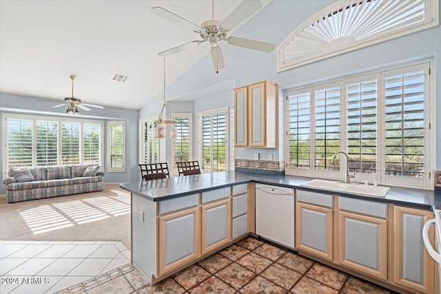 kitchen with dishwasher, sink, ceiling fan, kitchen peninsula, and light carpet