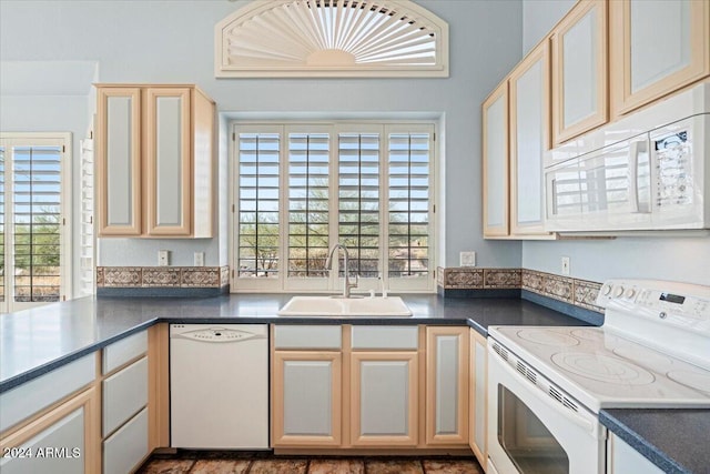 kitchen featuring sink and white appliances