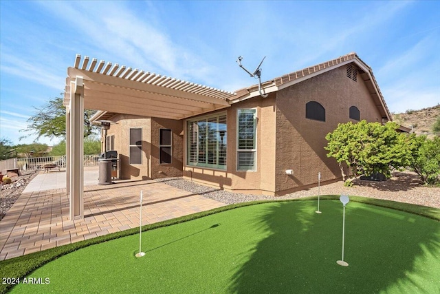 back of house featuring a patio and a pergola