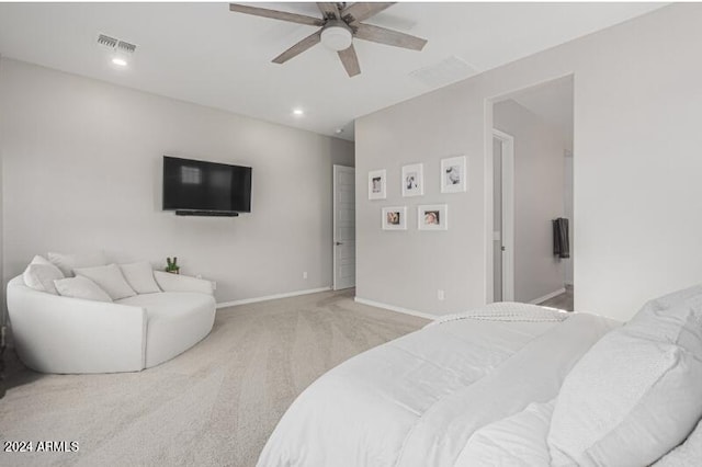 carpeted bedroom featuring ceiling fan and connected bathroom