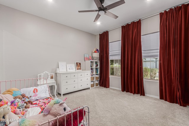 bedroom with light colored carpet and ceiling fan