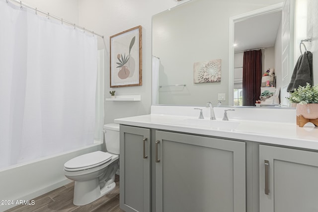 full bathroom with vanity, toilet, and shower / bath combo