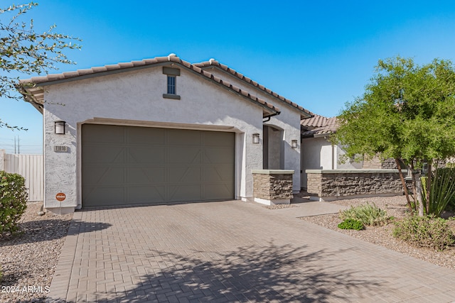 mediterranean / spanish house featuring a garage