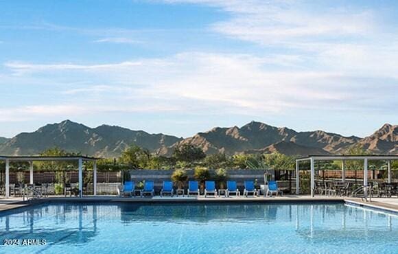 view of pool with a mountain view