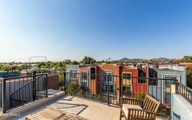 balcony with a mountain view and a residential view