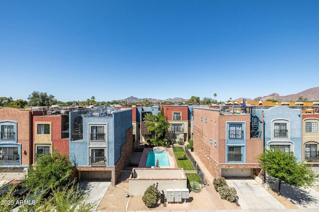 exterior space with a residential view and a mountain view