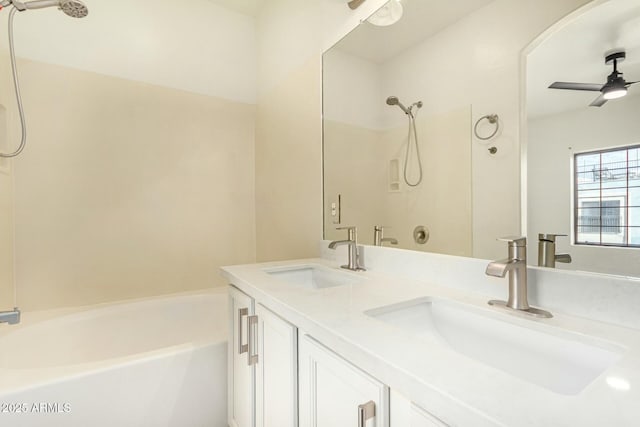 bathroom featuring a sink, ceiling fan, and double vanity