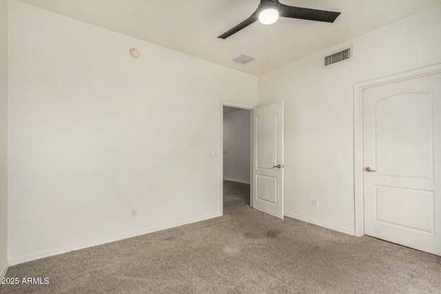 unfurnished bedroom featuring visible vents, baseboards, carpet, and a ceiling fan