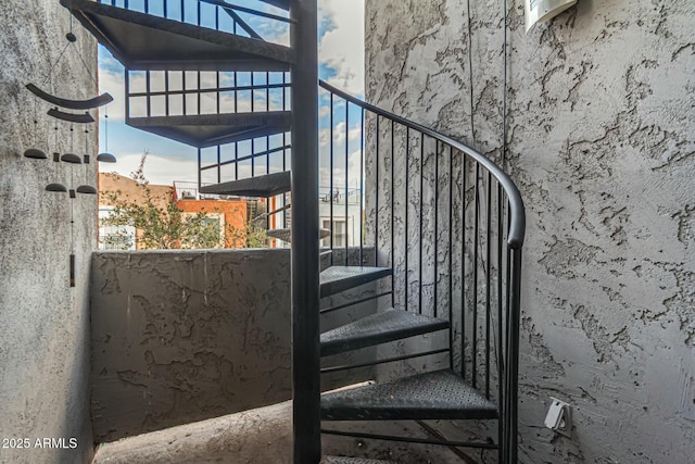 staircase featuring a wealth of natural light