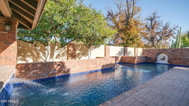 view of pool with pool water feature