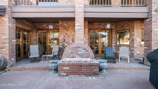 view of patio / terrace featuring french doors and a balcony