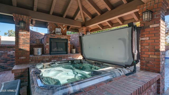 view of patio featuring a gazebo and a hot tub