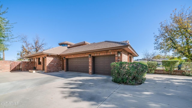 view of side of home with a garage