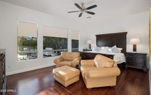 bedroom with visible vents, a ceiling fan, baseboards, and wood-type flooring