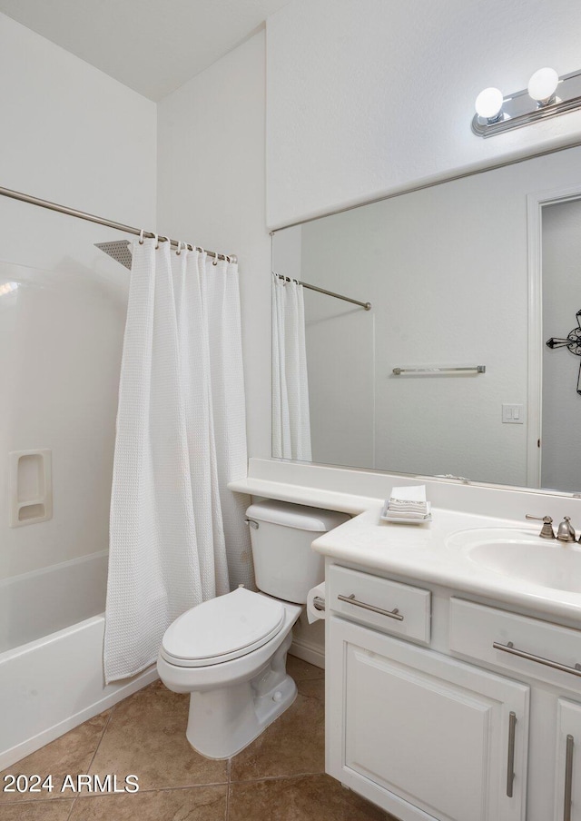 bathroom with tile patterned floors, vanity, toilet, and shower / bath combo with shower curtain