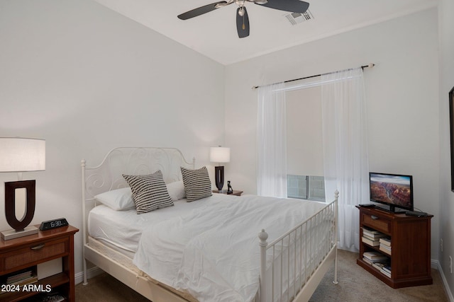 carpeted bedroom featuring visible vents and ceiling fan