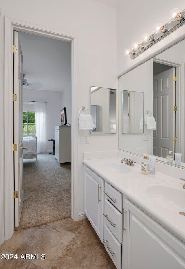 full bath with a sink and double vanity