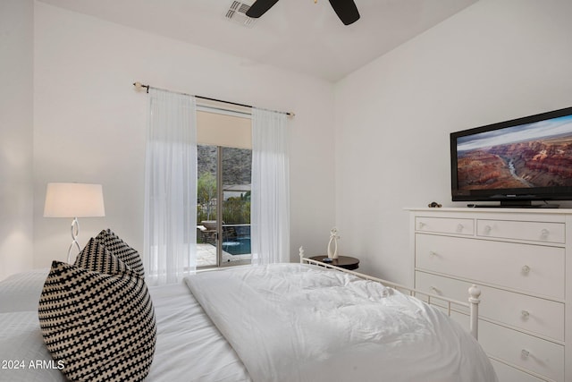 bedroom with ceiling fan, visible vents, and access to exterior