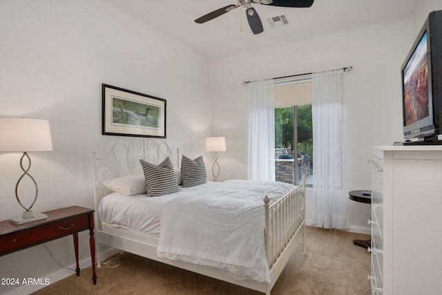 bedroom with visible vents, light carpet, baseboards, and a ceiling fan