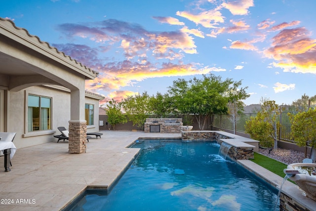 view of swimming pool with a patio, area for grilling, a fenced backyard, and a fenced in pool