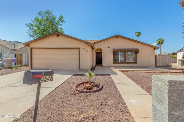 ranch-style home with a garage