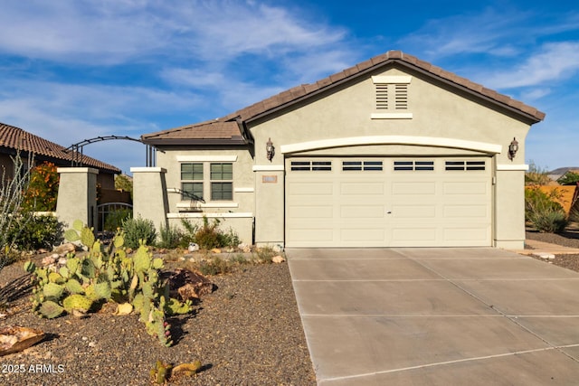 19667 N 260th Ln N, Buckeye, AZ 85396 - view of front of property featuring concrete driveway, stucco siding, a garage, and a tile roof