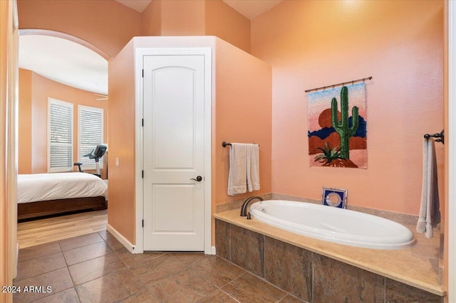 bathroom featuring tiled bath