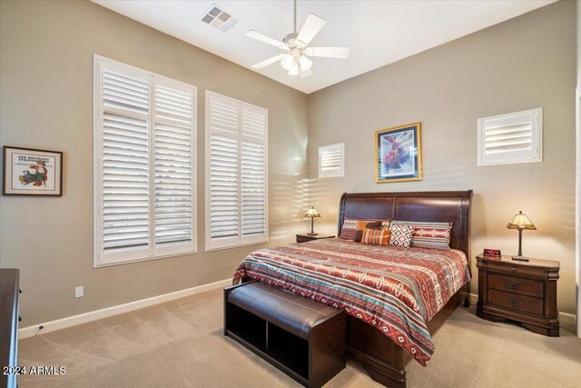 bedroom featuring ceiling fan and light colored carpet