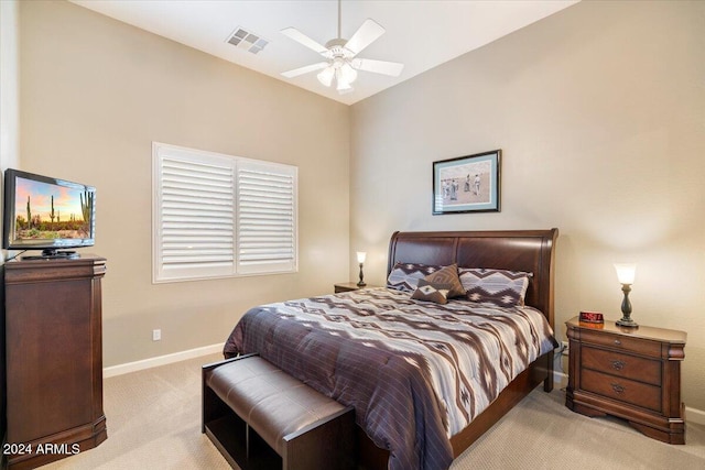 carpeted bedroom featuring ceiling fan and vaulted ceiling