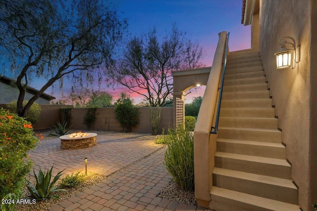 view of patio terrace at dusk