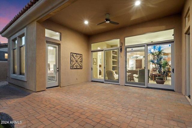 patio terrace at dusk with ceiling fan