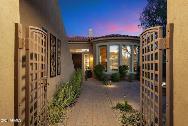 view of patio terrace at dusk