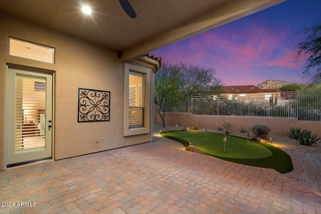 patio terrace at dusk with ceiling fan