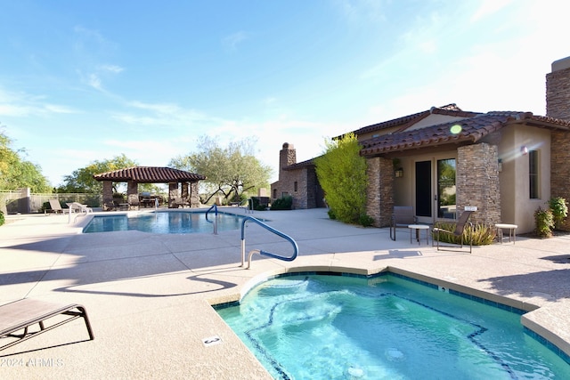 view of swimming pool with a gazebo and a patio