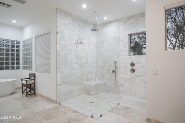 bathroom featuring plus walk in shower