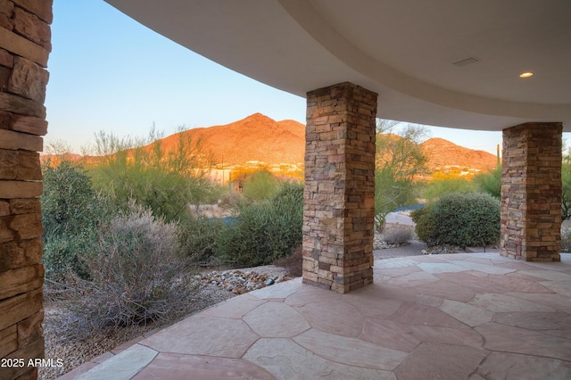 view of patio with a mountain view