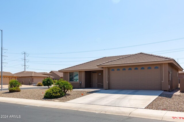 11235 E Pampa Ave, Mesa, AZ 85212 - ranch-style house featuring stucco siding, a tiled roof, a garage, and concrete driveway