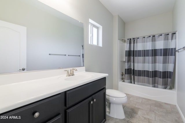 full bathroom featuring vanity, toilet, and shower / bath combination with curtain