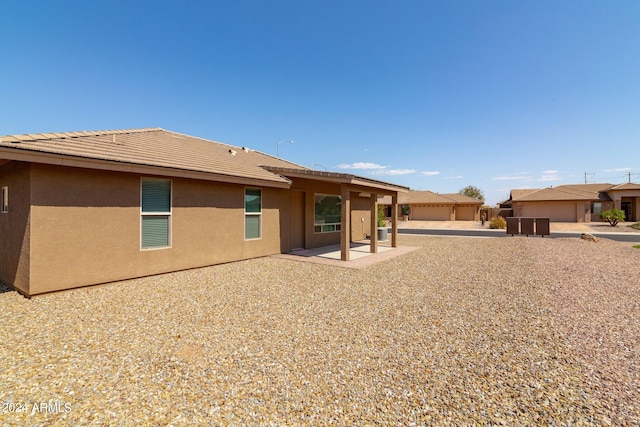 11235 E Pampa Ave, Mesa, AZ 85212 - back of property with a tile roof, stucco siding, and a patio area