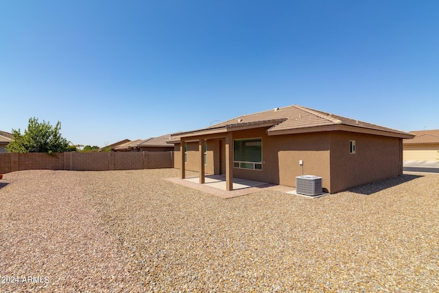 11235 E Pampa Ave, Mesa, AZ 85212 - rear view of property featuring a fenced backyard, central AC, a tile roof, stucco siding, and a patio area