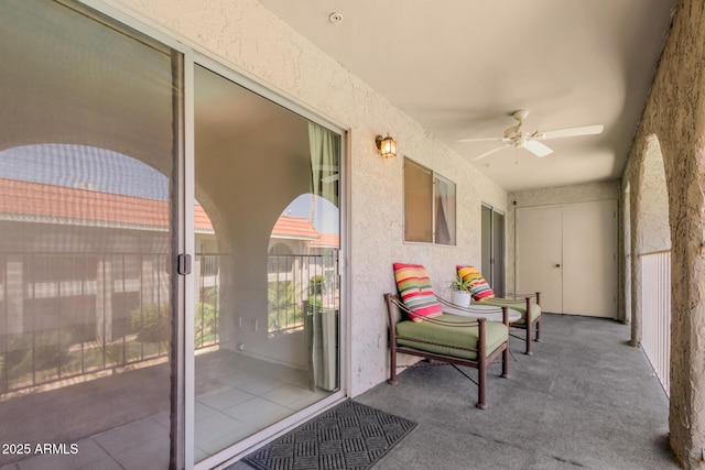 exterior space featuring a ceiling fan