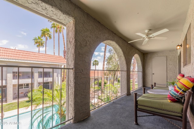 balcony featuring ceiling fan