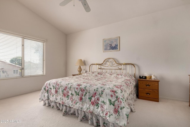 bedroom with carpet, vaulted ceiling, and a ceiling fan